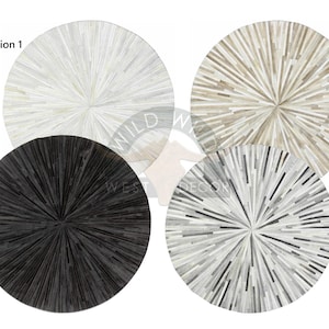 May include: Four round cowhide rugs in different color variations. The rugs have a starburst pattern with a white, black, gray, and beige color scheme.