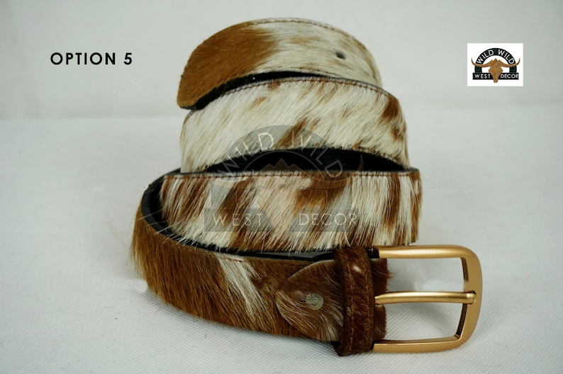 May include: A set of three ceramic mugs with a speckled, matte finish. Each mug features a different color: light blue, cream, and gray. The mugs have a simple, modern design and a comfortable handle.