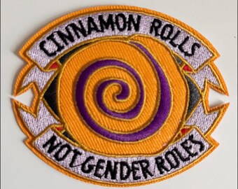 Iron On Patch – “Cinnamon Rolls Not Gender Roles” – Orange Embroidered Patch with Cinnamon Bun Design
