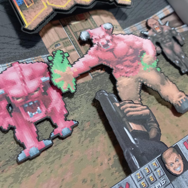 Close-up of the layered classic DOOM artwork, showing the raised demon figures, shotgun and game HUD details.