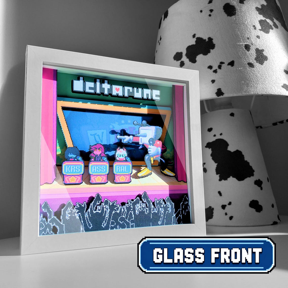 White-framed Deltarune Chapter 3 shadow box displayed beside a lamp