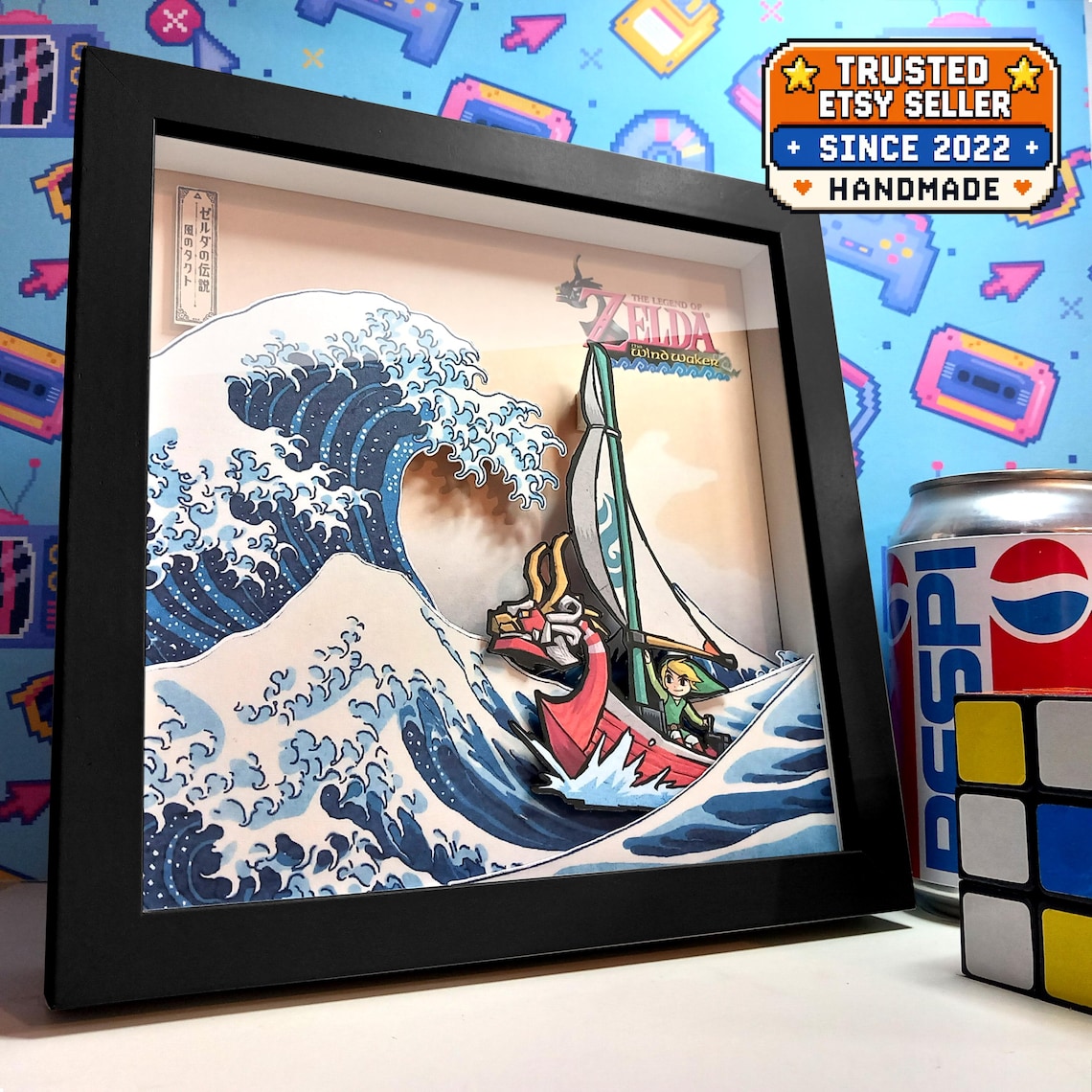 Black-framed Wind Waker shadow box showing Link and the King of Red Lions sailing through a Great Wave-inspired scene