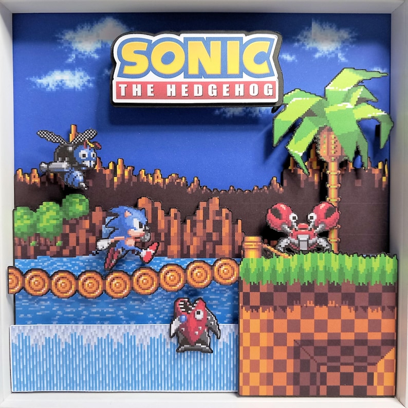 Front view of the layered Green Hill Zone artwork with Sonic, Motobug, Buzz Bomber and Crabmeat enemies.