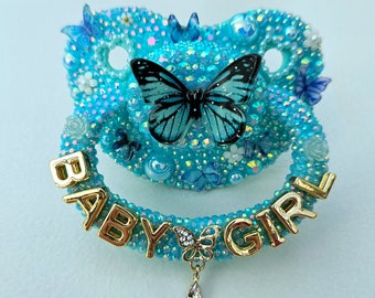 Blauwe vlinder babymeisje Paci