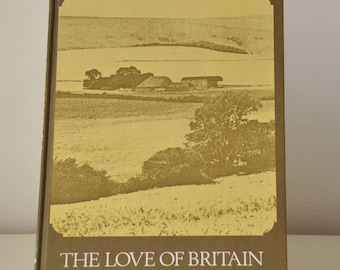 May include: A brown book with a yellow image of a countryside scene on the cover. The title "THE LOVE OF BRITAIN" is printed in white on the bottom of the cover.