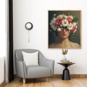 May include: A painting of a woman with a floral crown covering her eyes. The flowers are white and pink, and the background is a dark green.