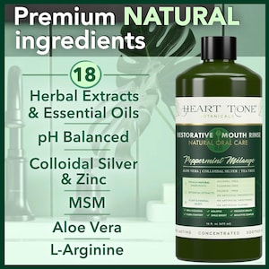 Peut inclure: Une bouteille verte de bain de bouche réparateur Heart Tone Botanicals. L'étiquette met en évidence "Peppermint Mélange" et "Natural Oral Care". Le texte sur l'étiquette mentionne également "Aloe Vera" et "Colloidal Silver". Le texte supplémentaire indique "Premium Natural Ingredients" et "18 Herbal Extracts & Essential Oils."