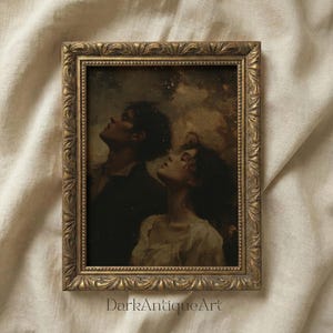 May include: A framed vintage print featuring two figures gazing upwards. The artwork, set in a gold ornate frame, depicts a man and a woman with their faces tilted towards the sky. The text "DarkAntiqueArt" is visible at the bottom.