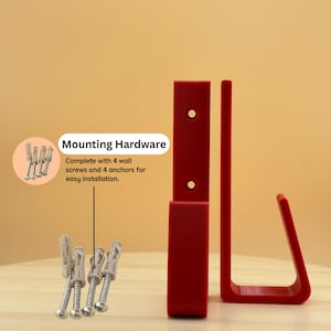 May include: Red wall-mounted hook set with mounting hardware. The set includes 4 screws and 4 anchors for easy installation. The hook has a modern, minimalist design.