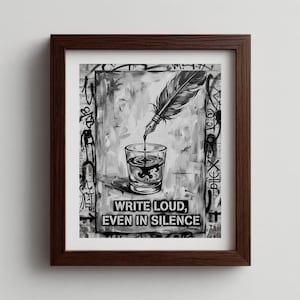 May include: Framed black and white artwork featuring a quill pen dripping ink into a glass. The artwork has a graffiti-style background and the text "WRITE LOUD, EVEN IN SILENCE" in a bold font.