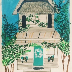 May include: A hand-painted illustration of a white house with a teal door and a wreath. The house has a gray roof and is surrounded by green trees.