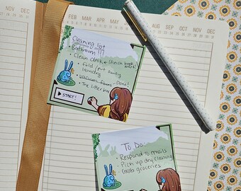 May include: Two green and white illustrated to-do list sticky notes with a cartoon bunny and a girl holding a red ball. The first note says "Cleaning list" and lists household chores. The second note says "To Do" and lists tasks like "Respond to emails" and "Pick up dry cleaning".