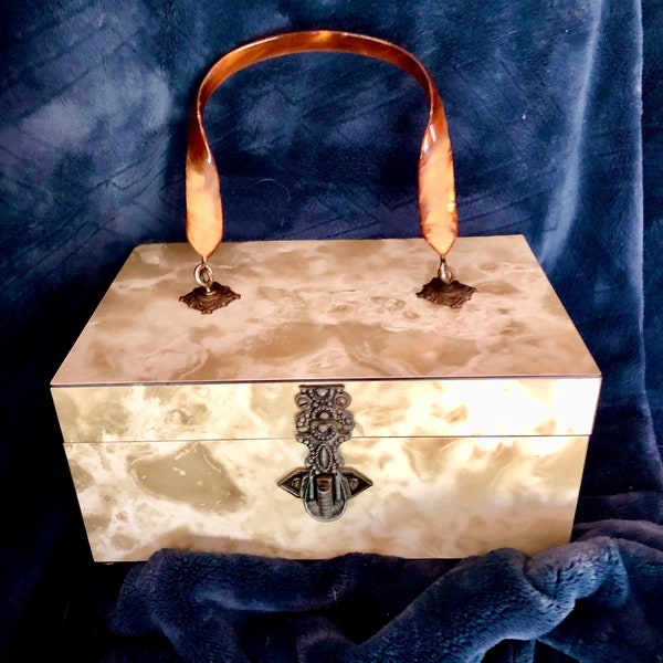 1950’s Golden & White Pearlescent Swirl Marble Box Purse Handbag, Tortoiseshell Lucite Handle, Mirror, Intricate Twist Lock Closure, Footed