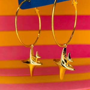 Golden four-point star hoop earrings