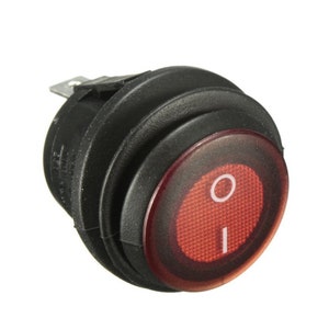 May include: A black and red rocker switch with a red LED indicator light. The switch is round and has a black plastic housing. The LED light is on and illuminates the switch.