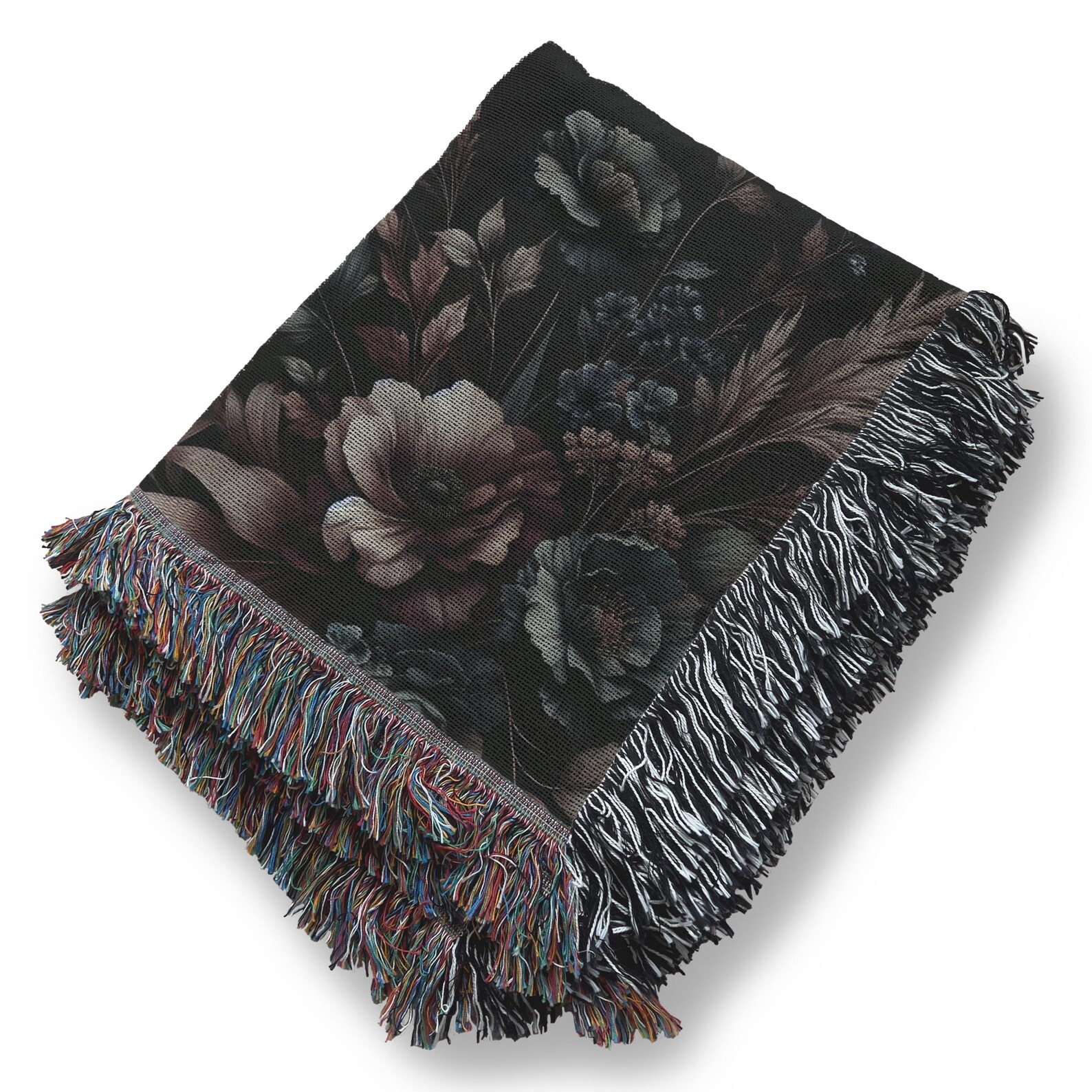 Folded black floral throw blanket with baroque-style pattern and colorful fringe, displayed on a white background