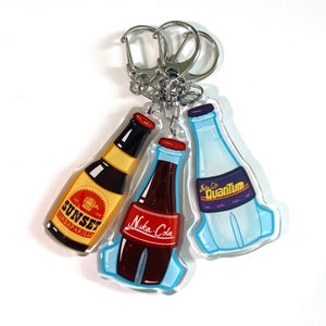 FALLOUT Nuka-Cola/Sunset Sarsaparilla Keychain - Double Sided, Epoxy-Acrylic, 2.5” Height