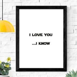 May include: A black framed print with a white background and the text "I LOVE YOU...I KNOW" in black.
