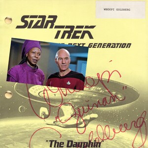 May include: A yellow script page from the Star Trek: The Next Generation television series with a photo of Whoopi Goldberg and Patrick Stewart. The page is signed by Whoopi Goldberg with the title "The Dauphin" and the date December 14, 1988.