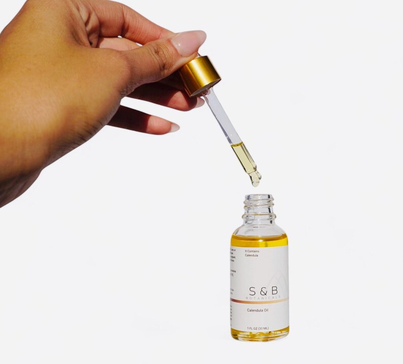 Natural face and body oil made with calendula jojoba and sweet almond oil