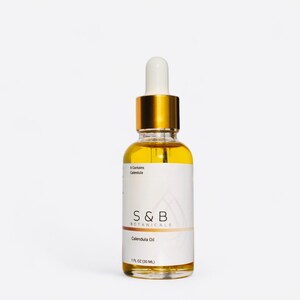 Calendula face and body oil in glass dropper bottle for natural skincare