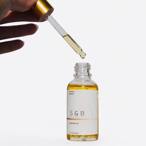 Close up of calendula infused oil showing golden color and texture