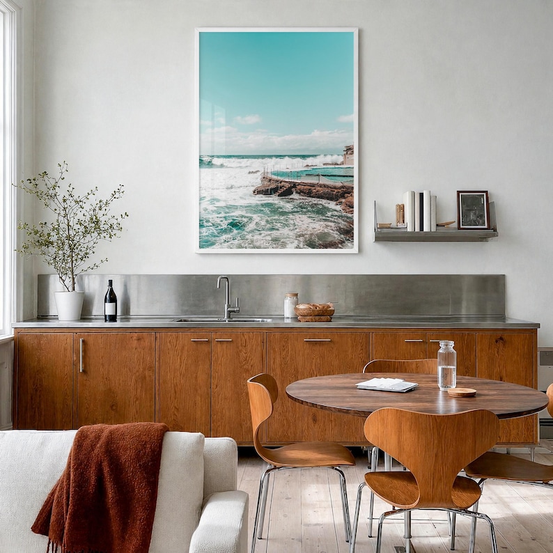 Bronte Beach Ocean Pool Fine Art Photo Print, sydney poster, full image (no border) in a white wood frame, hanging in a kitchen with a dining area