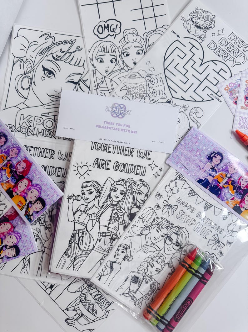 May include: A collection of coloring pages featuring line art illustrations of cartoon characters, with the text "OMG!", "Together We Are Golden", and "Happy Birthday Sophie". Includes a pack of crayons.