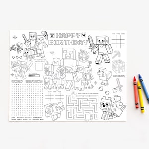 May include: A black and white Minecraft-themed birthday placemat featuring characters, a word search, and a maze. The words "Happy Birthday" are at the top. Three crayons in red, yellow, and blue are on the right.