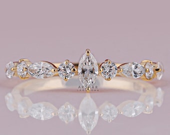 Anillo de media eternidad con diamantes cultivados en laboratorio, talla marquesa y redonda alternadas.