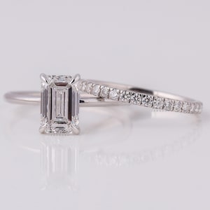 May include: A set of three ceramic mugs with a speckled, matte finish. Each mug is in a different colour: light blue, cream, and grey. The mugs have a simple, modern design with a rounded shape and a comfortable handle.