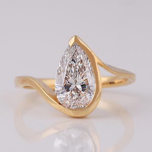 May include: A white ceramic mug with a black handle and the text "But First, Coffee" in a bold, black font. The mug is set against a neutral background, highlighting its simple design.