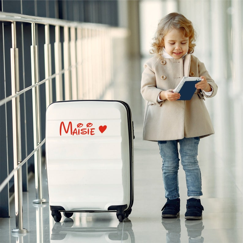 Custom suitcase sticker name. Red sticker with heart. Custom-made in three different sizes.
