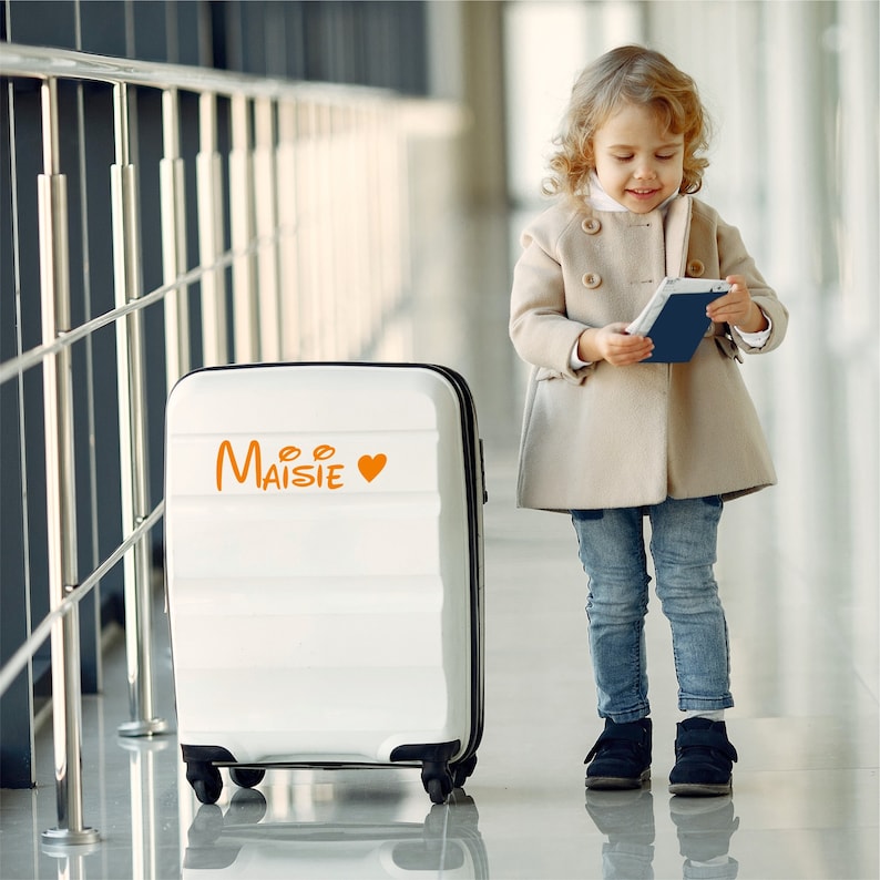 Custom suitcase sticker name. Orange sticker with heart. Custom-made in three different sizes.