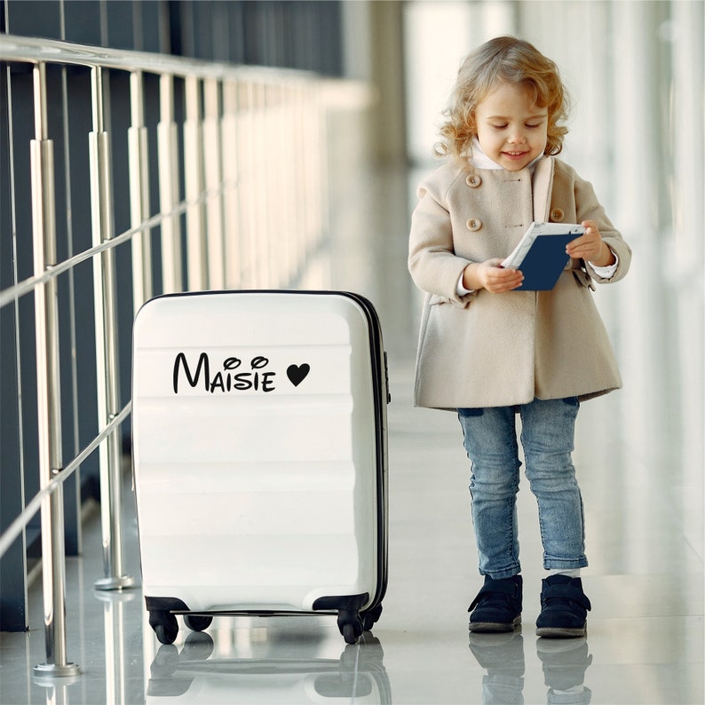 Custom suitcase sticker name. Black sticker with heart. Custom-made in three different sizes.