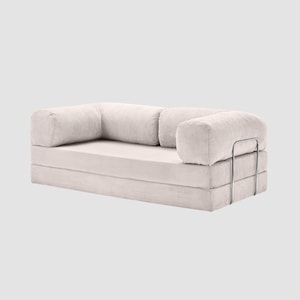 May include: A set of three ceramic mugs with a speckled, matte finish. The mugs are in shades of cream, light brown, and dark brown. Each mug has a simple, minimalist design, perfect for coffee or tea.