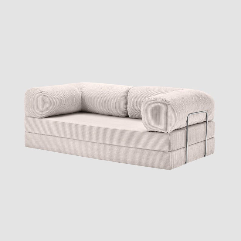 May include: A set of three ceramic mugs with a speckled, matte finish. The mugs are in shades of cream, light brown, and dark brown. Each mug has a simple, minimalist design, perfect for coffee or tea.