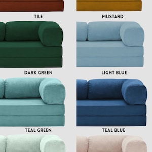 May include: A white ceramic mug with a black handle and the text "But First, Coffee" in a bold, black font. The mug is set against a blurred background, suggesting a cozy setting.