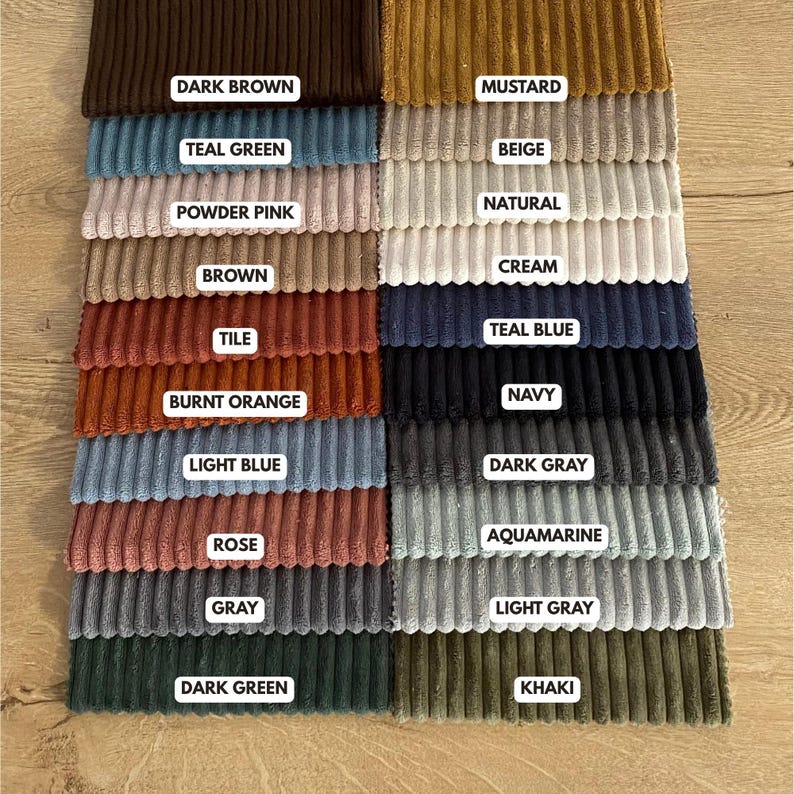 May include: A color swatch of corduroy fabric samples in various colors, including dark brown, mustard, teal green, powder pink, brown, tile, burnt orange, light blue, rose, gray, dark green, beige, natural, cream, teal blue, navy, dark gray, aquamarine, light gray, and khaki. Each color is labeled.