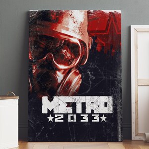 May include: A canvas print featuring a distressed design with a red gas mask and the text "METRO 2033" in white. The artwork has a dark, textured background with a grunge aesthetic, and a red star.