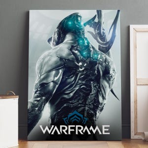May include: A rectangular wall art print featuring a dark, biomechanical figure with glowing cyan accents on its back and head. The figure is depicted from behind, showcasing intricate armor plating. The word WARFRAME is printed in white at the bottom.