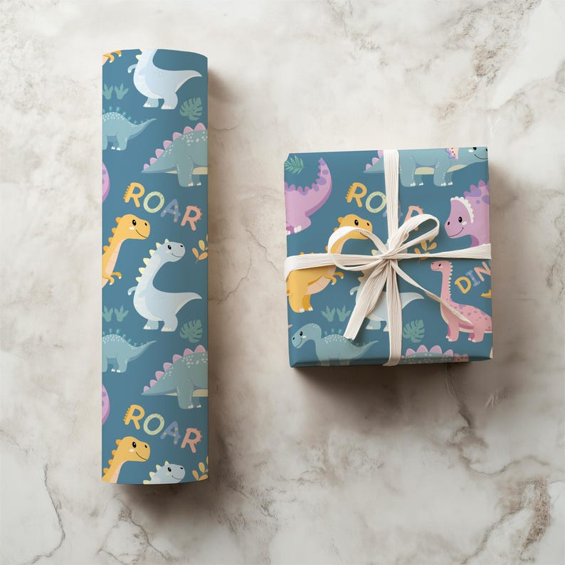 May include: Blue wrapping paper and a wrapped gift box featuring a colorful dinosaur pattern. The design includes various dinosaurs, the word "ROAR", and other decorative elements. The gift box is tied with a white ribbon.