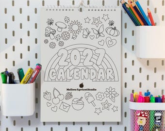 May include: A white wall calendar for the year 2027 with black line art illustrations including a rainbow, mushrooms, flowers, butterflies, hearts, stars, fruit, and an ice cream cone. The text MellowApricotStudio is printed in the center.