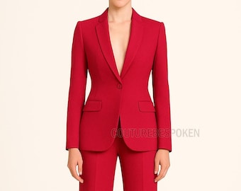 May include: A vibrant red suit, featuring a tailored blazer with a single-button closure and two front pockets, paired with matching trousers. The image displays the suit on a person against a neutral background. The text "COUTUREBESPOKEN" is visible.