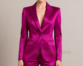 May include: A magenta satin suit, featuring a tailored blazer with a single-button closure and a notched lapel. The blazer has two front pockets. The text "COUTUREBESPOKEN" is visible on the lower portion of the image. The suit appears to be a formal wear ensemble.