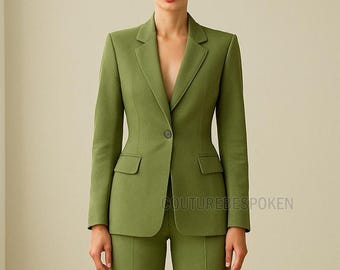 May include: A tailored olive green suit featuring a single-button blazer with two front pockets and matching trousers. The suit has a classic lapel design and a fitted silhouette. The text "COUTUREBESPOKEN" is visible on the lower right.