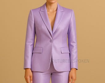 May include: A light purple suit, featuring a tailored blazer with a single-button closure and two front pockets, paired with matching trousers. The suit has a classic lapel design and a sleek, professional appearance. The text "COUTUREBESPOKEN" is visible.