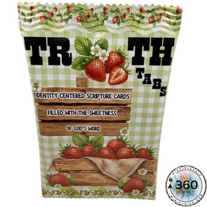 May include: A box of "Truth Tabs" scripture cards. The box features a green and white gingham pattern with strawberry illustrations. Text on the box reads "Identity Centred Scripture Cards Filled with the Sweetness of God's Word."