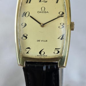1968 Montre tank mécanique OMEGA DE VILLE pour homme vintage plaquée or fabriquée en Suisse