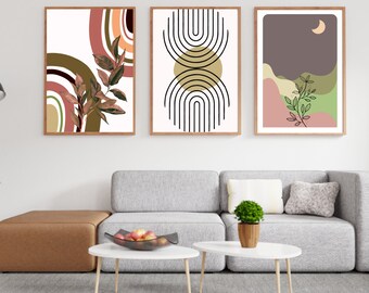 May include: Three framed abstract art prints with a modern minimalist style. The prints feature geometric shapes, lines, and foliage in shades of brown, green, pink, and white.